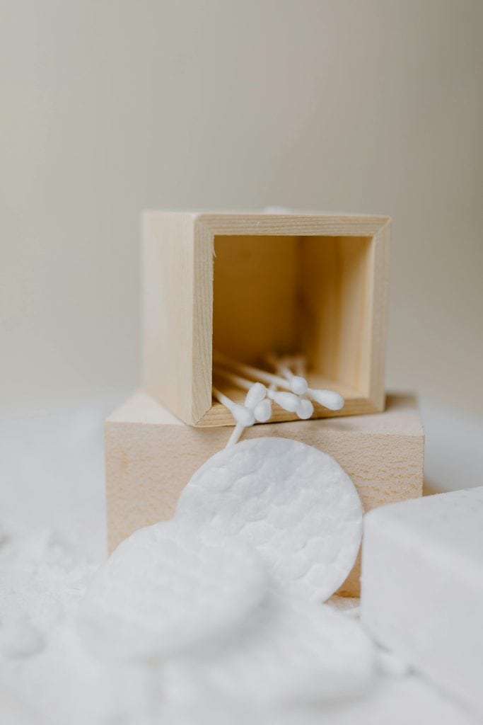 Using cotton swabs for safe whitehead removal at home